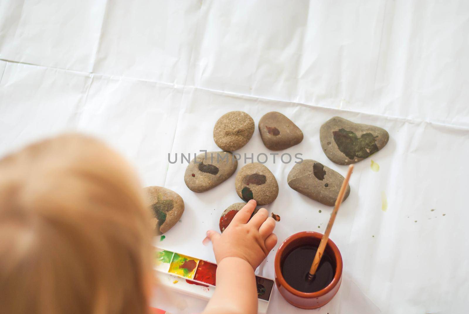 toddler paints with gouache. High quality photo