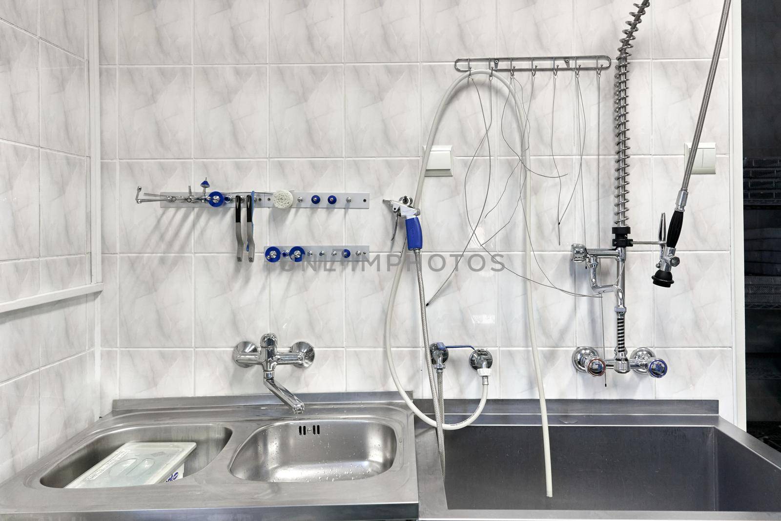 Isolated hospital room with sink for washing equipment