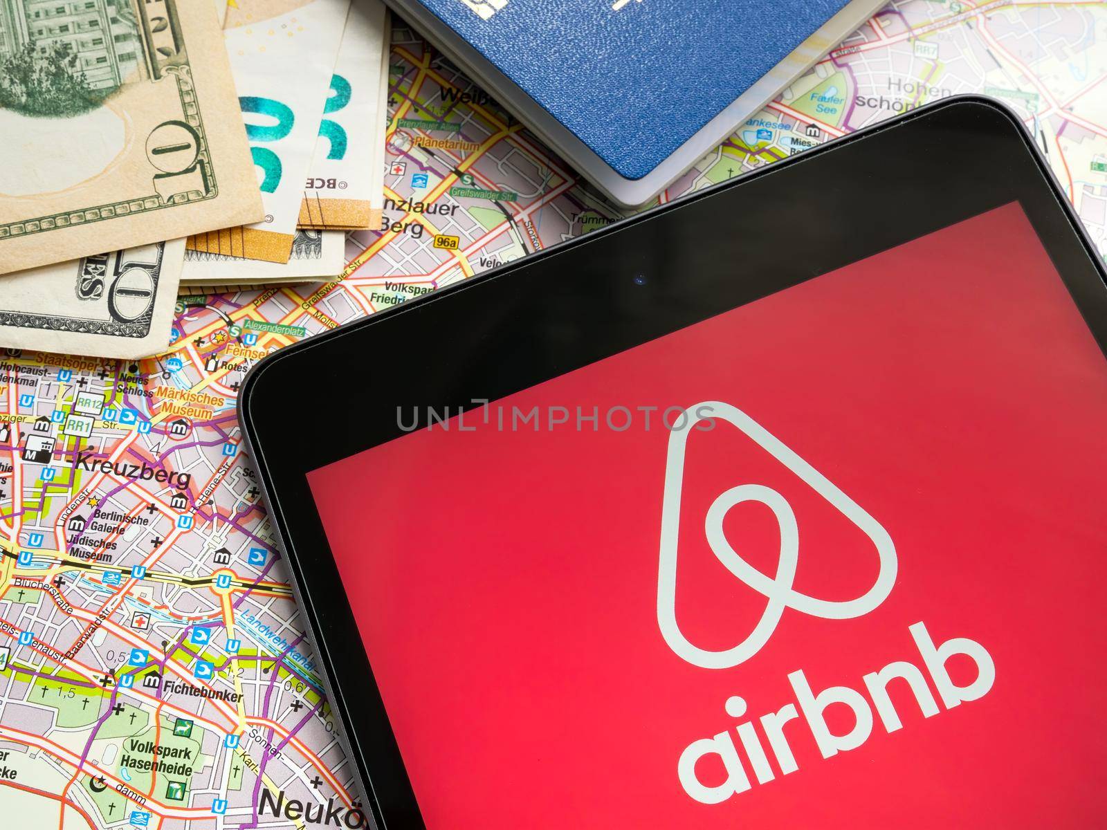 KYIV, UKRAINE - July 21, 2022. Tablet with Airbnb logo and a map. Editorial.