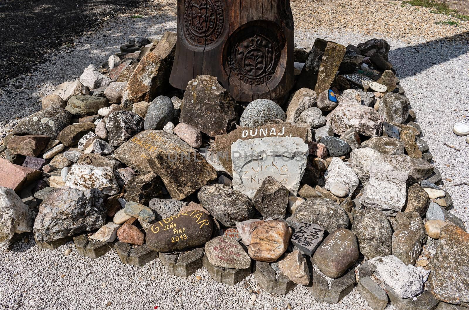 Stones with inscriptions from places from different parts of the world in a sweat place under the cross II by rostik924