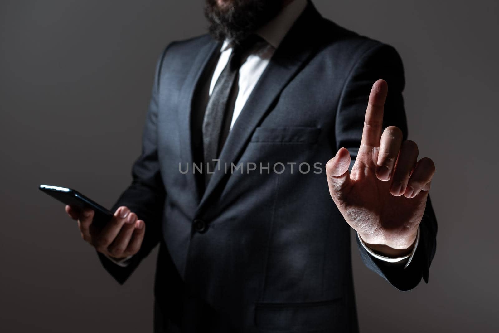 Businessman Holding Tablet And Pointing With One Finger On Important Message. Executive In Suit Presenting Crutial Information. Gentleman Showing Critical Announcement. by nialowwa