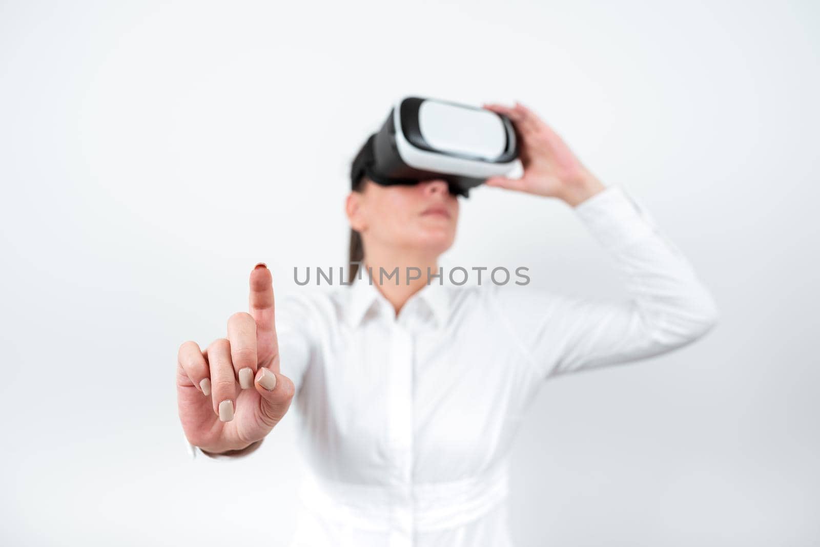 Woman Wearing Vr Glasses And Pointing On Important Message With One Finger.