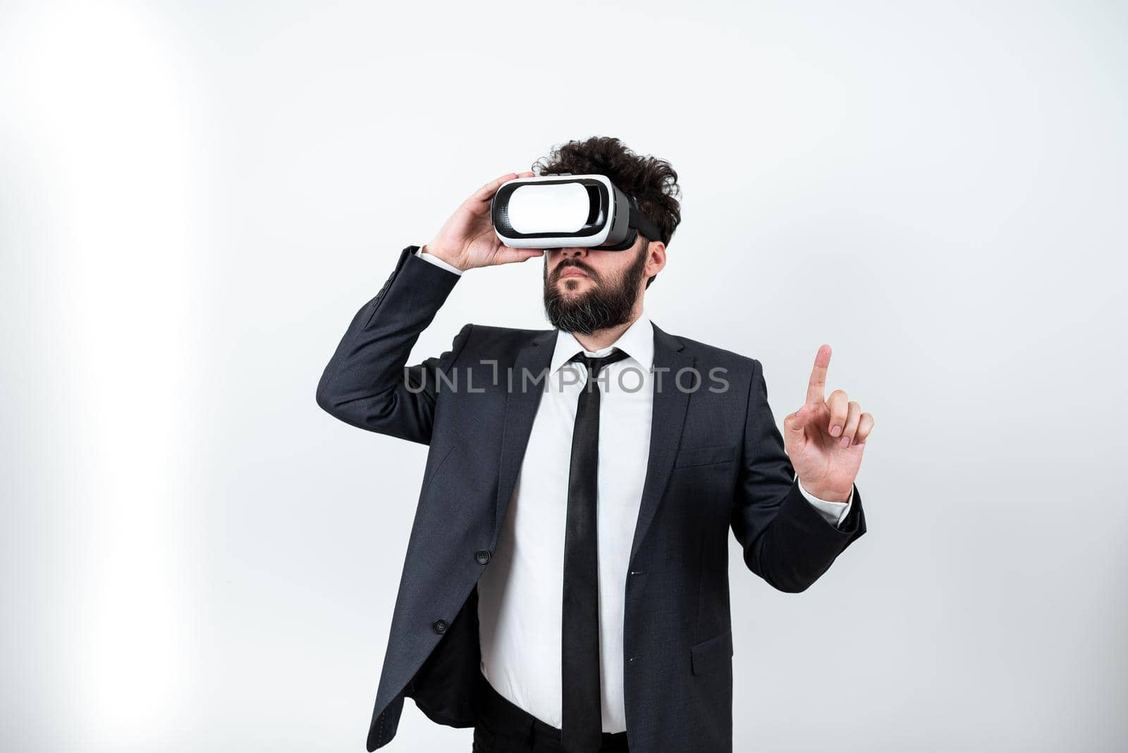 Man Wearing Vr Glasses And Pointing On Important Messages With One Finger.