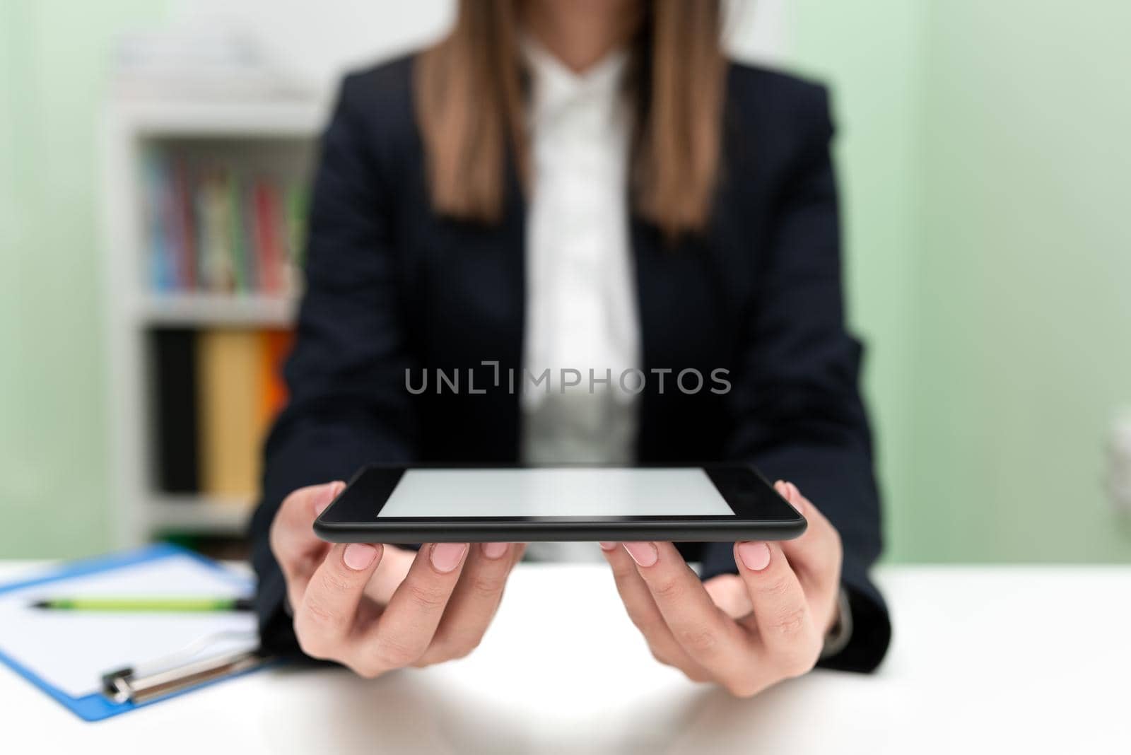 Sitting Businesswoman Holding Cellphone With Important Message.