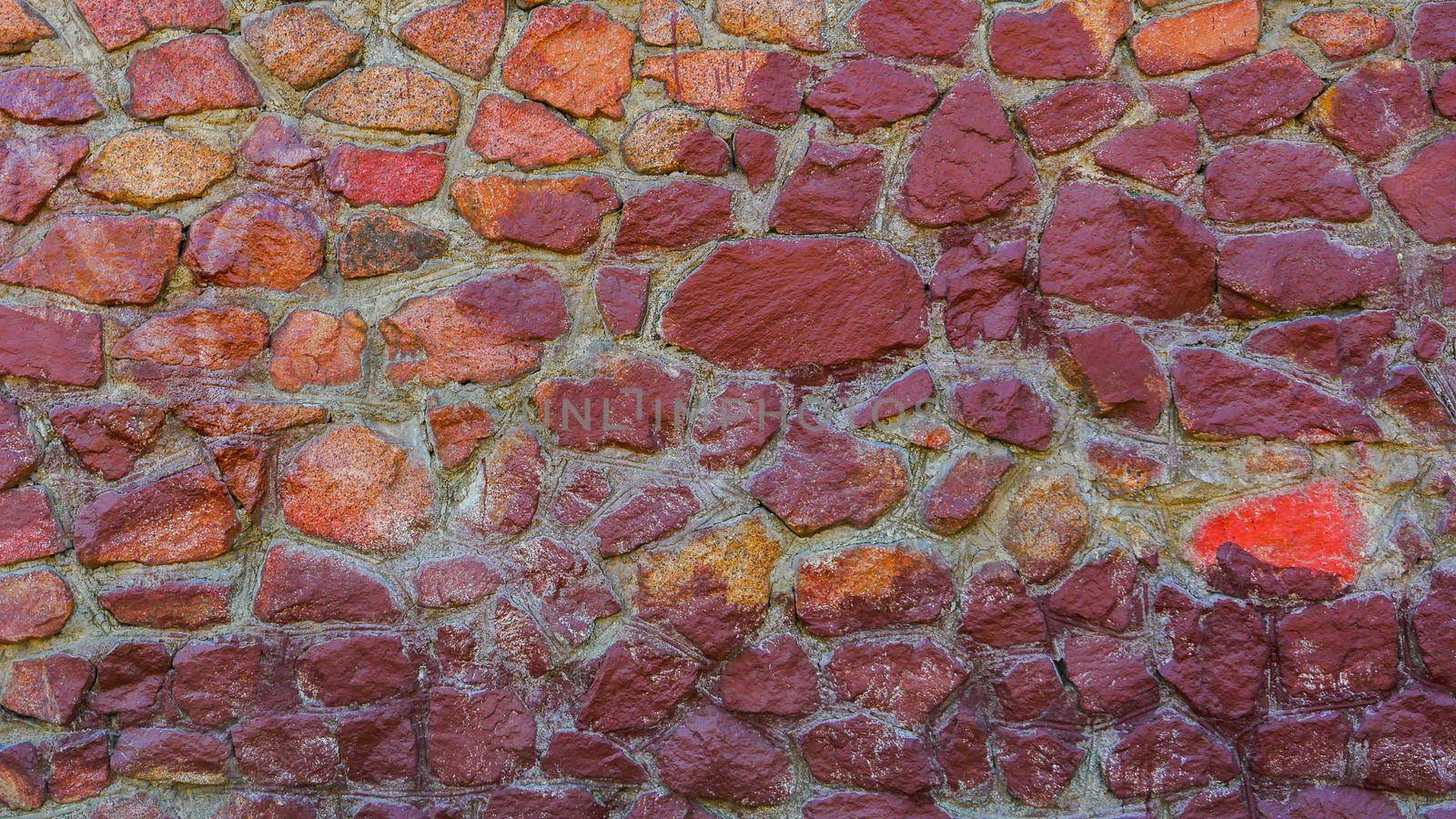 Abstract background of a multi-colored stone wall