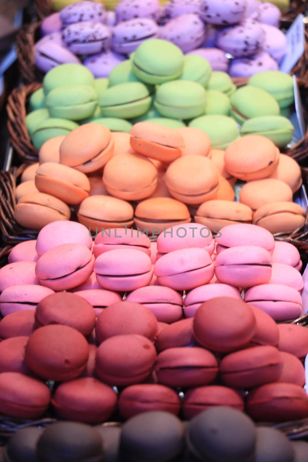 Macarons in different colors and flavors on a a market