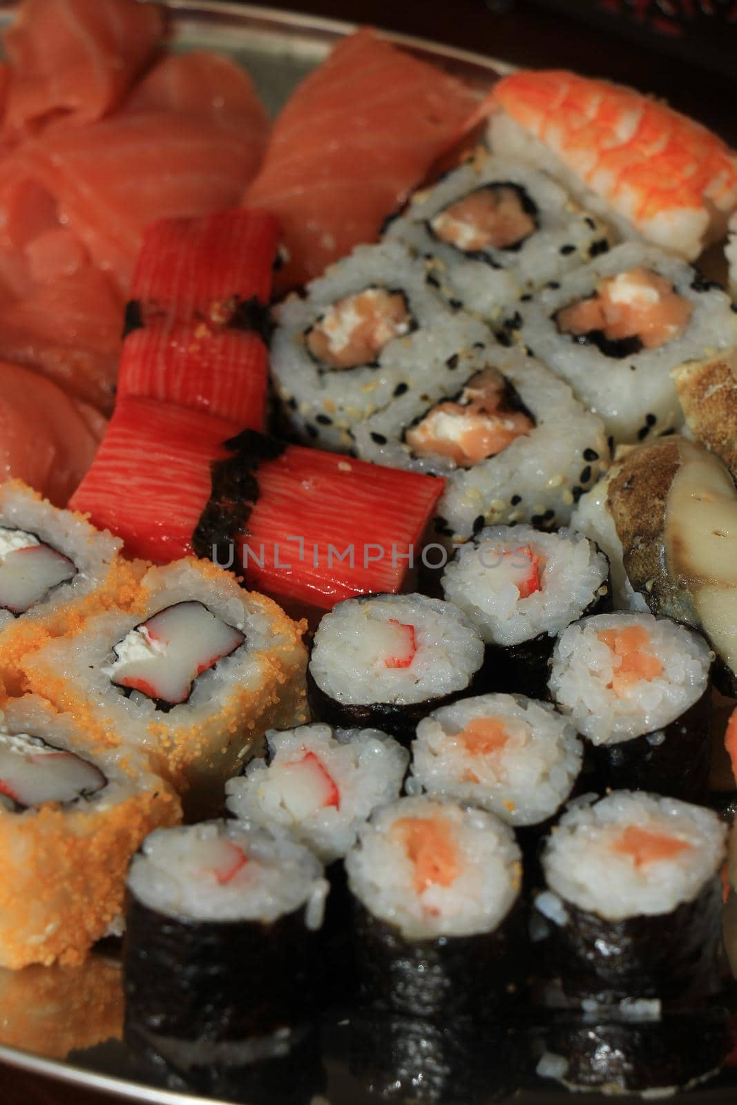 Japanese sushi and sashimi, various sorts on a serving plate