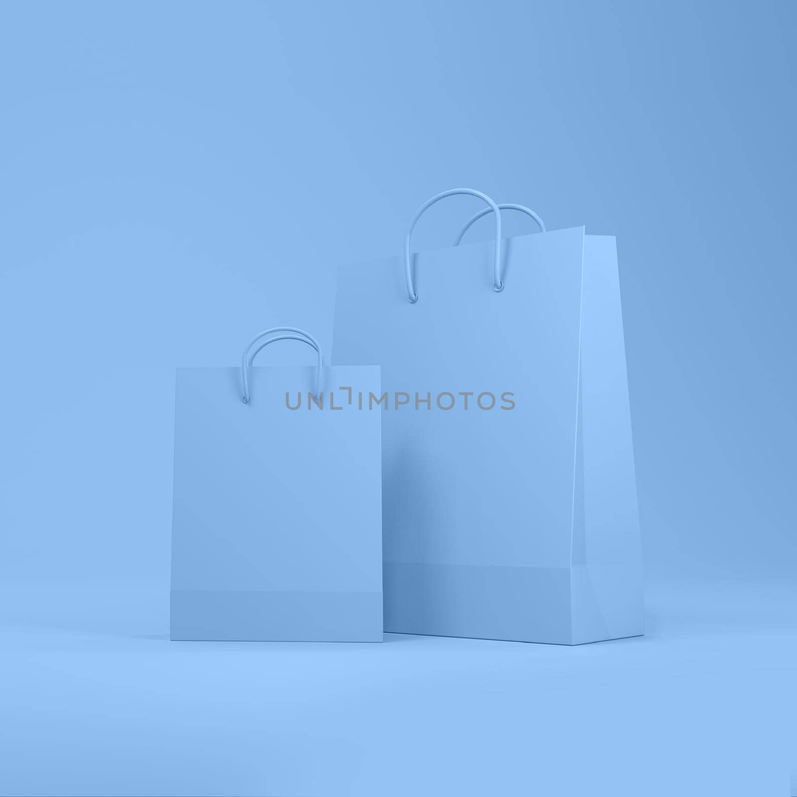Shopping bags in blue background with space for text or design. by ImagesRouges
