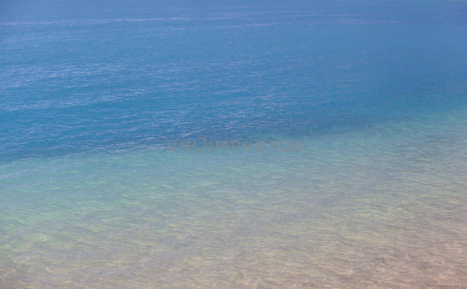 Seascape of clear water on the sea. Clear water on the ocean, sea or lake. Water ripples in the sun.
