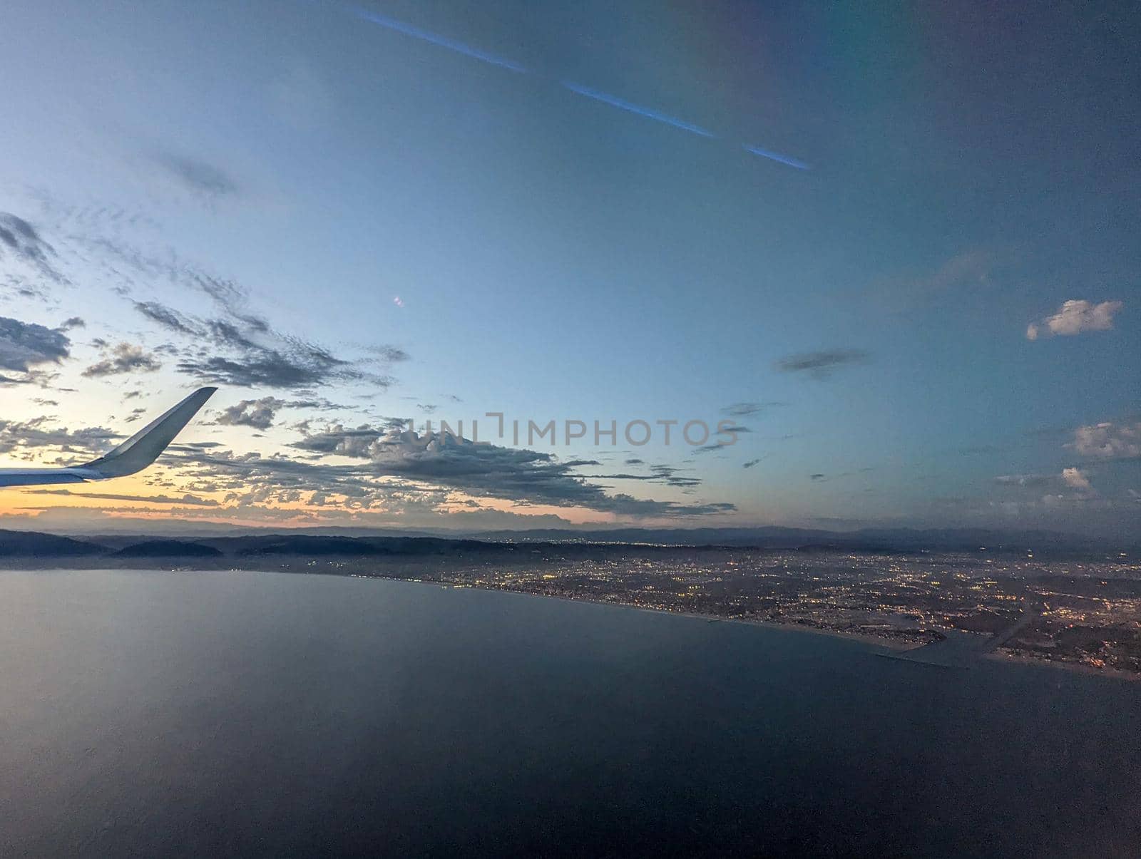 Clouds and sky as seen through window of an aircraft by digidreamgrafix