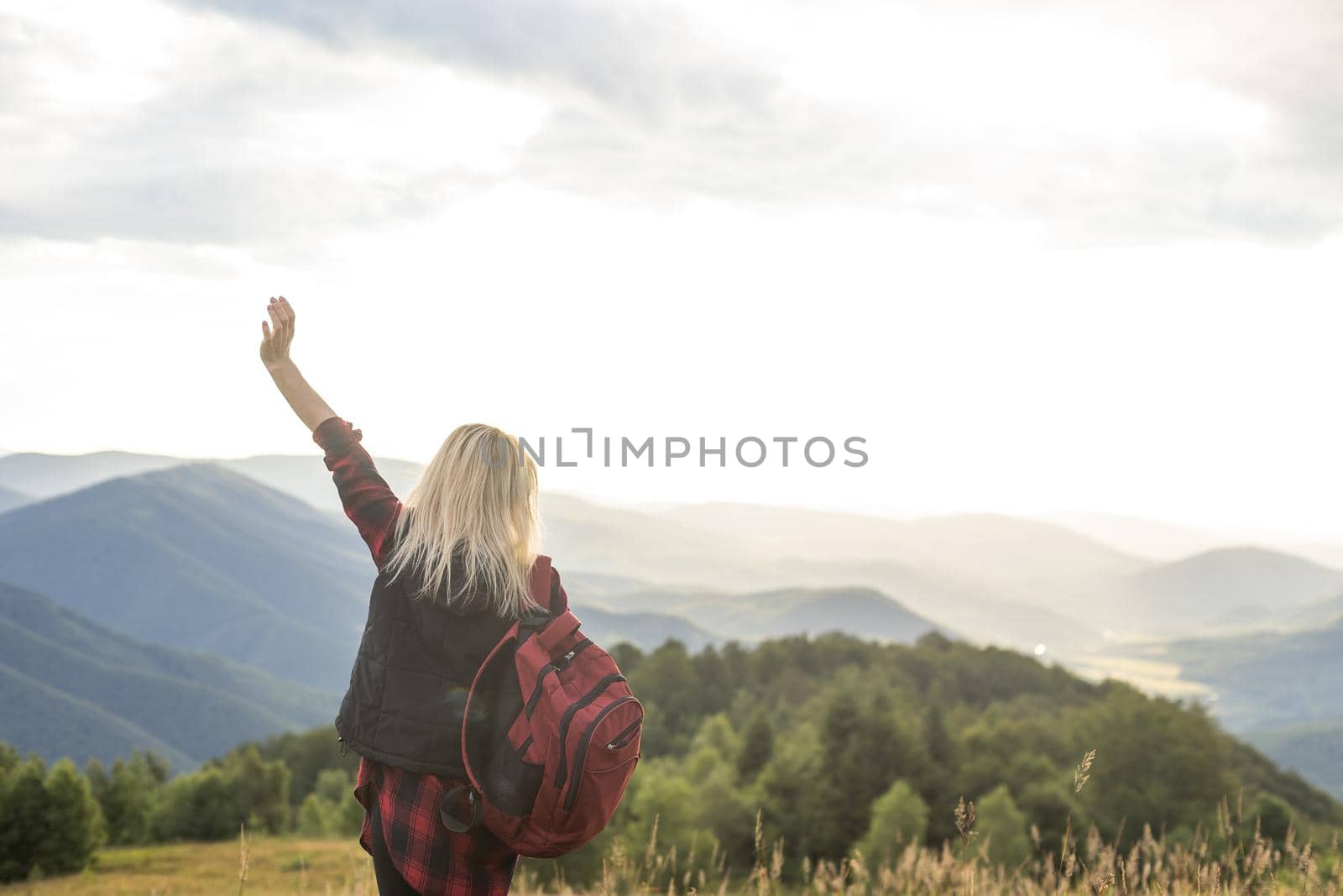 woman backpacker enjoy the view at mountain.