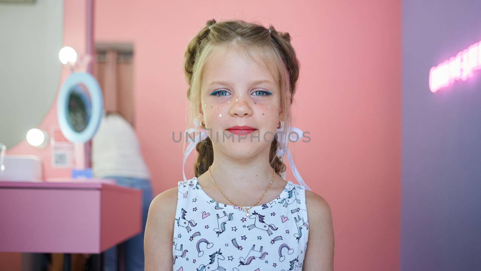 Children make up. Glitter makeup. Sparkles on cheek