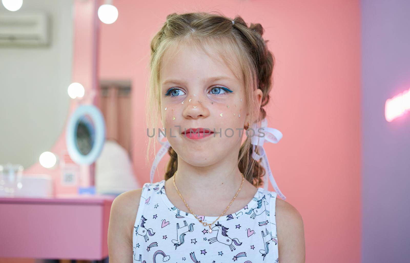 Children make up. Glitter makeup. Sparkles on cheek. by sarymsakov
