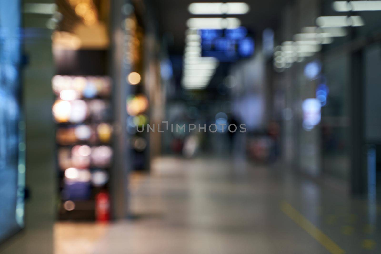 Blurred international airport interior background with bokeh and copy space