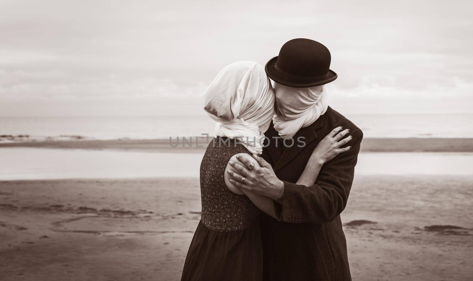 Faceless portrait of man kissing woman with white fabrics on their heads. Image in vintage retro style. Sepia toned and film grain added