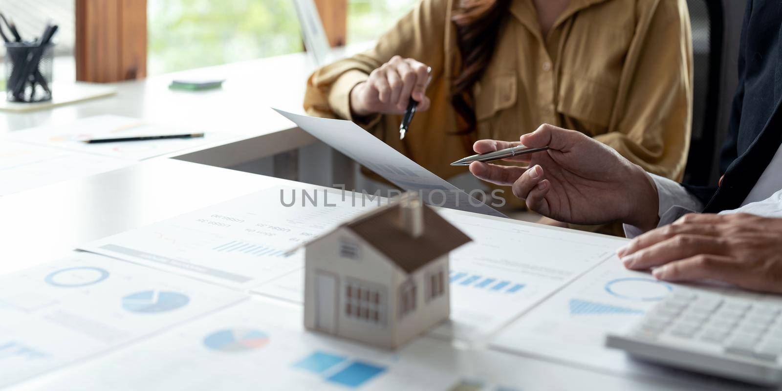 Couple calculating financial chart for investment to buying property. business real estate concept
