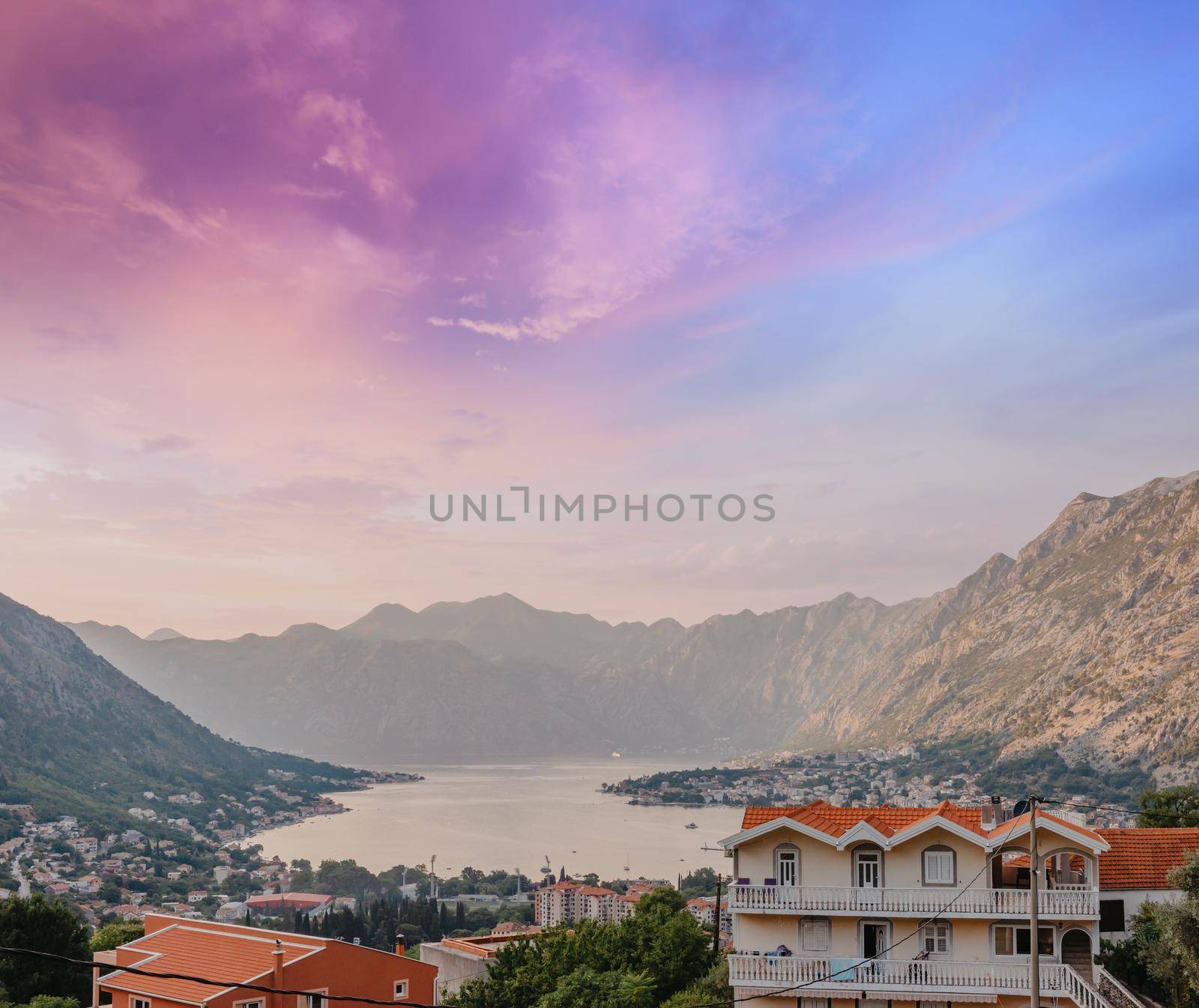 Sunset, beautiful landscape with silhouettes of trees. Travel concept. Montenegro, Kotor Bay. Sunset at Kotor Bay Montenegro. View of the sunset in Boko-Kotor Bay in Montenegro.