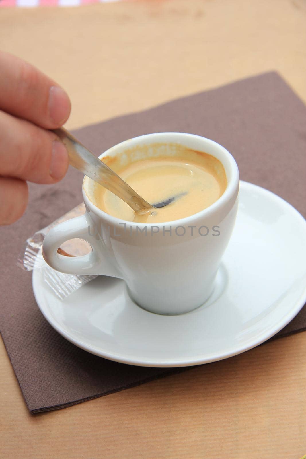 Man stiring an espresso