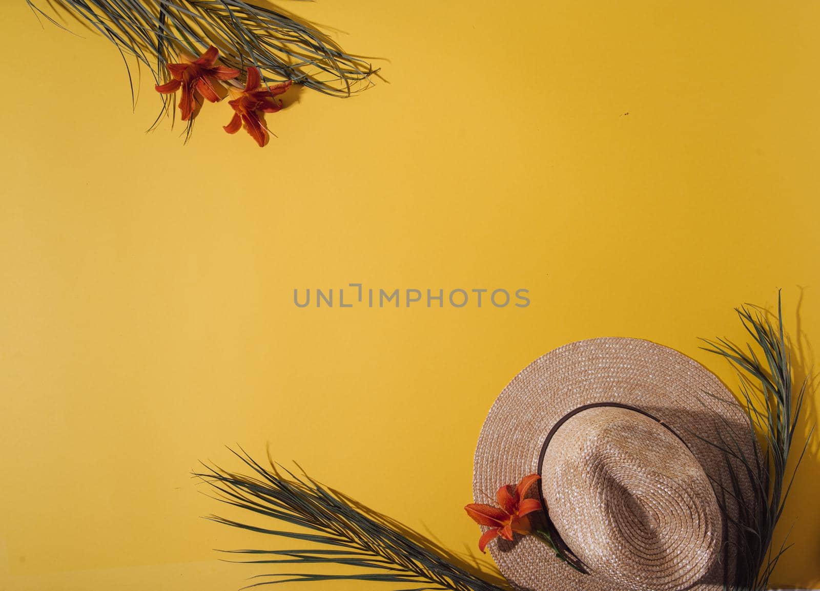 ummer background with straw hat and bag and palm leaves. High quality photo