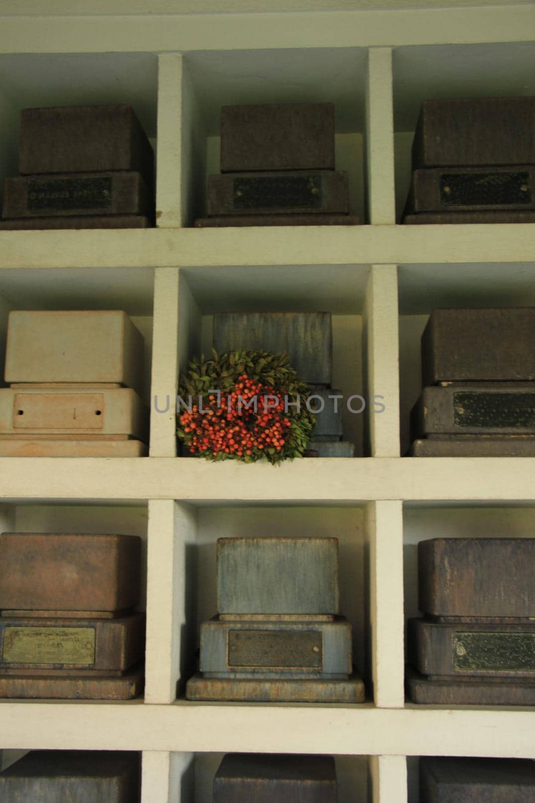 Urns with ashes in a columbarium wall