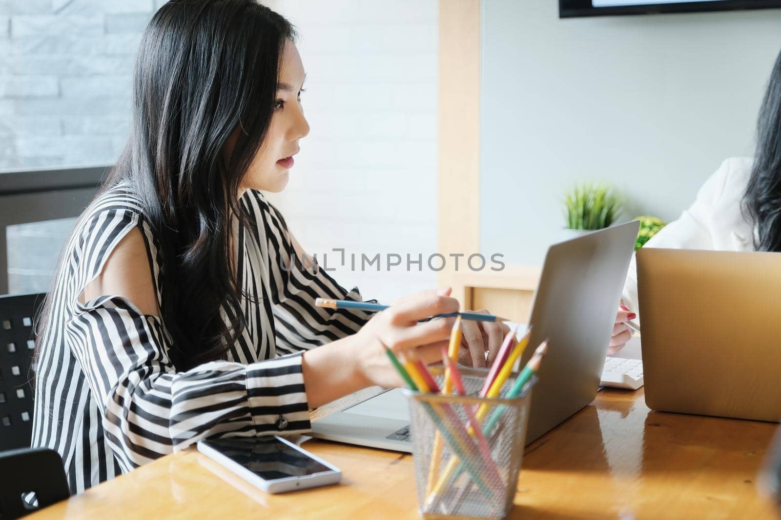 freelance concept,female using computers to design work as ordered by customers. by Manastrong