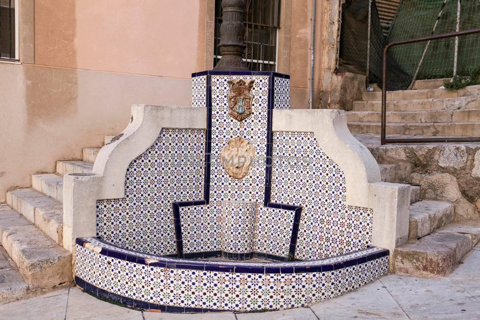 Cartagena, Murcia, Spain- July 18, 2022: Fountain made of tiles and stone in San Gines de la Jara Square in Cartagena village, Murcia