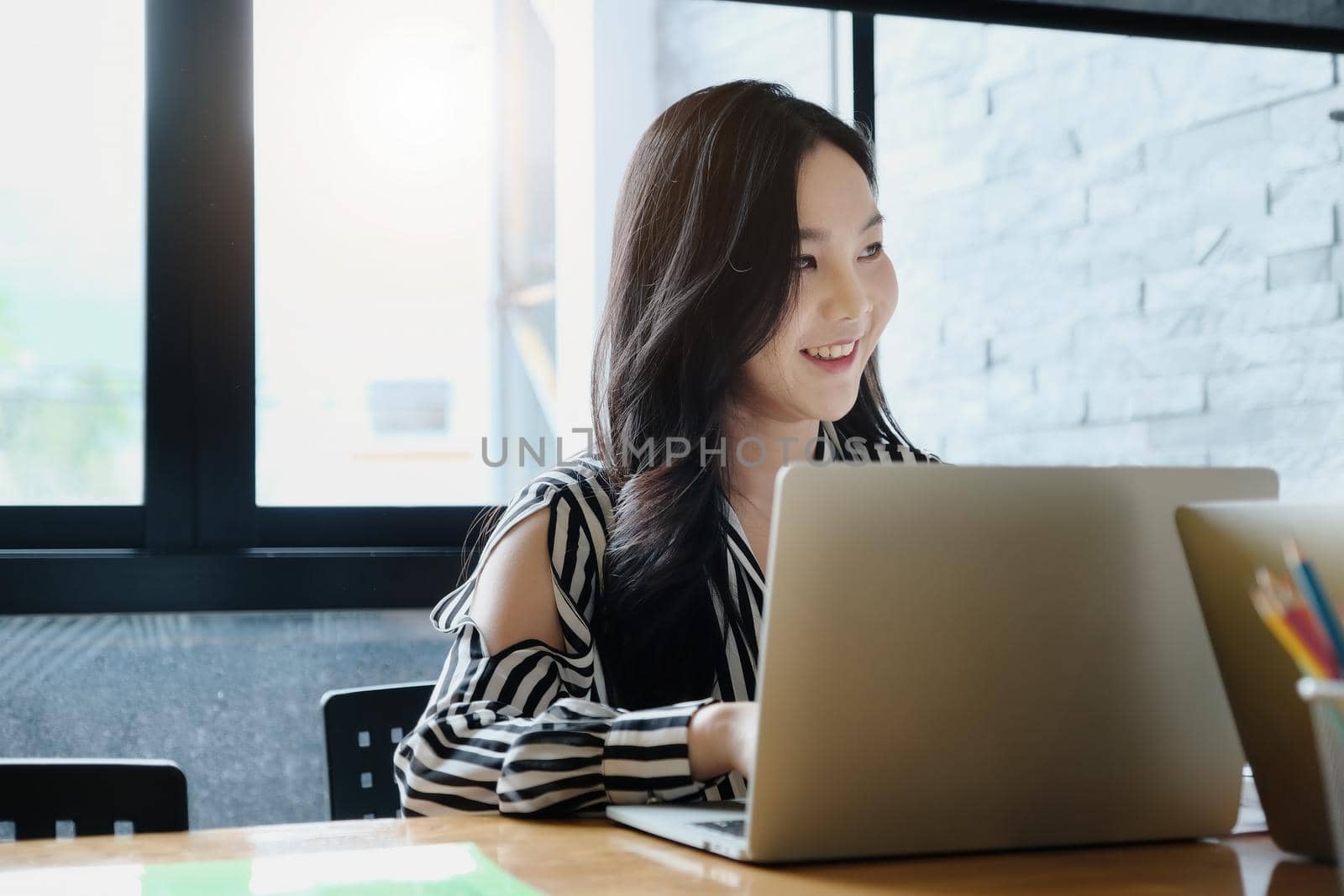 freelance concept,female using computers to design work as ordered by customers