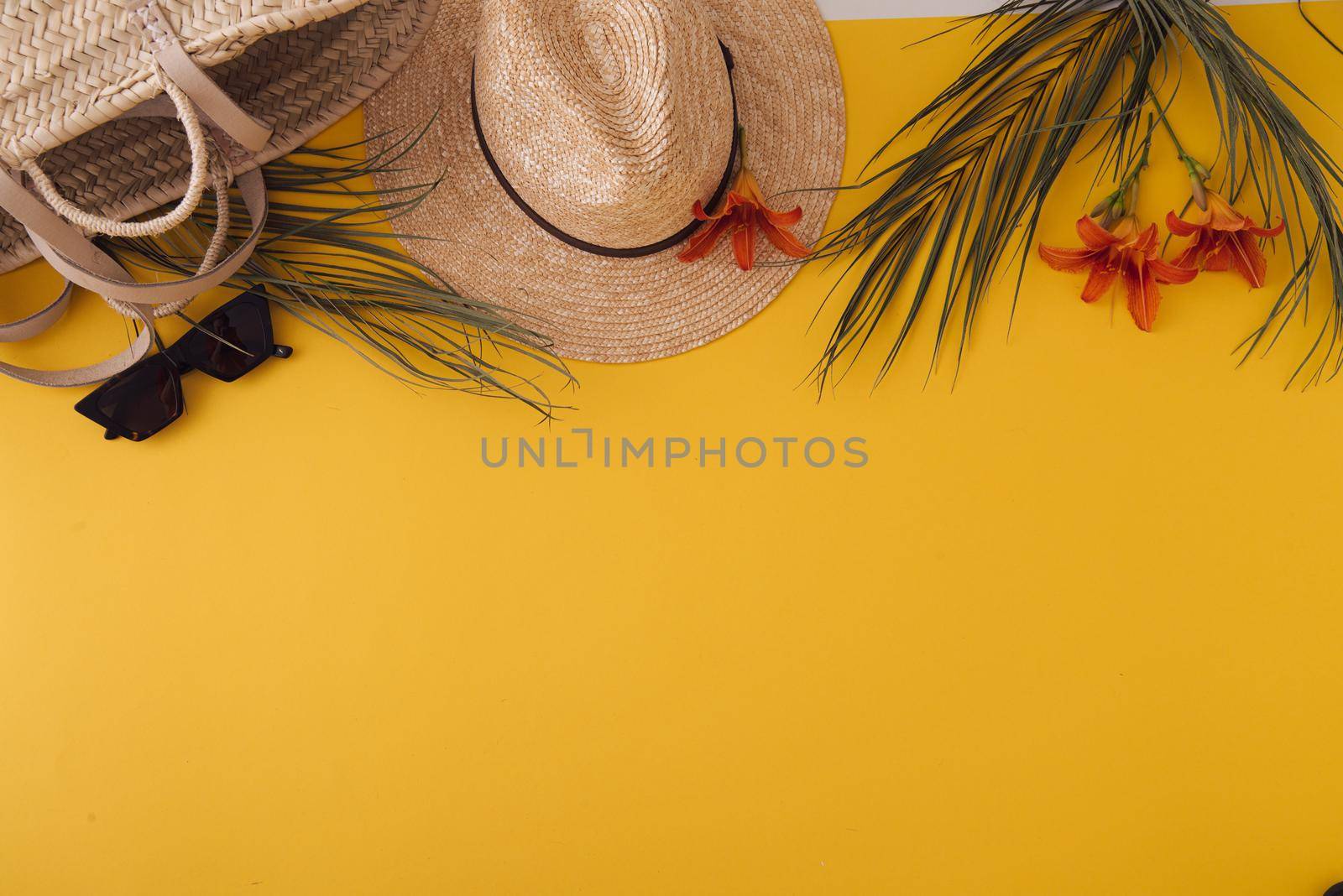 ummer background with straw hat and bag and palm leaves by maramorosz