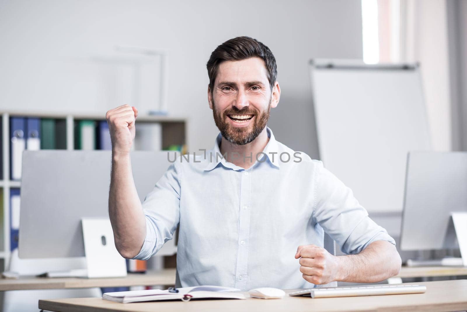 Happy and successful businessman looking at webcam talking to colleagues. online meeting, happy smiling