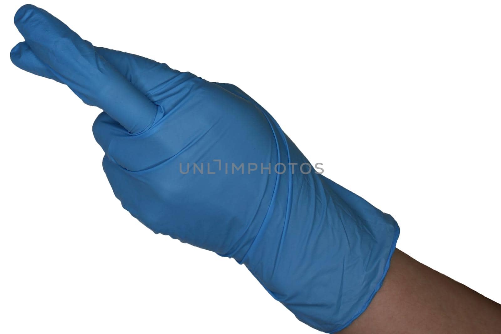 Isolated hand in a blue medical glove with fingers crossed on a white background..