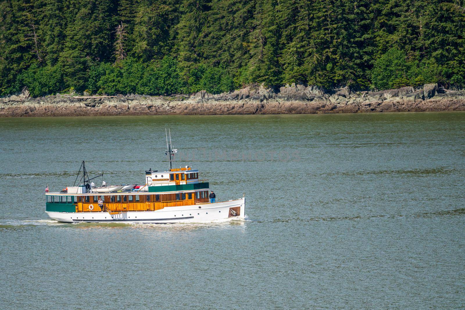 Juneau, AK - 9 June 2022: View of the the MV Discovery historic yacht cruising from Juneau