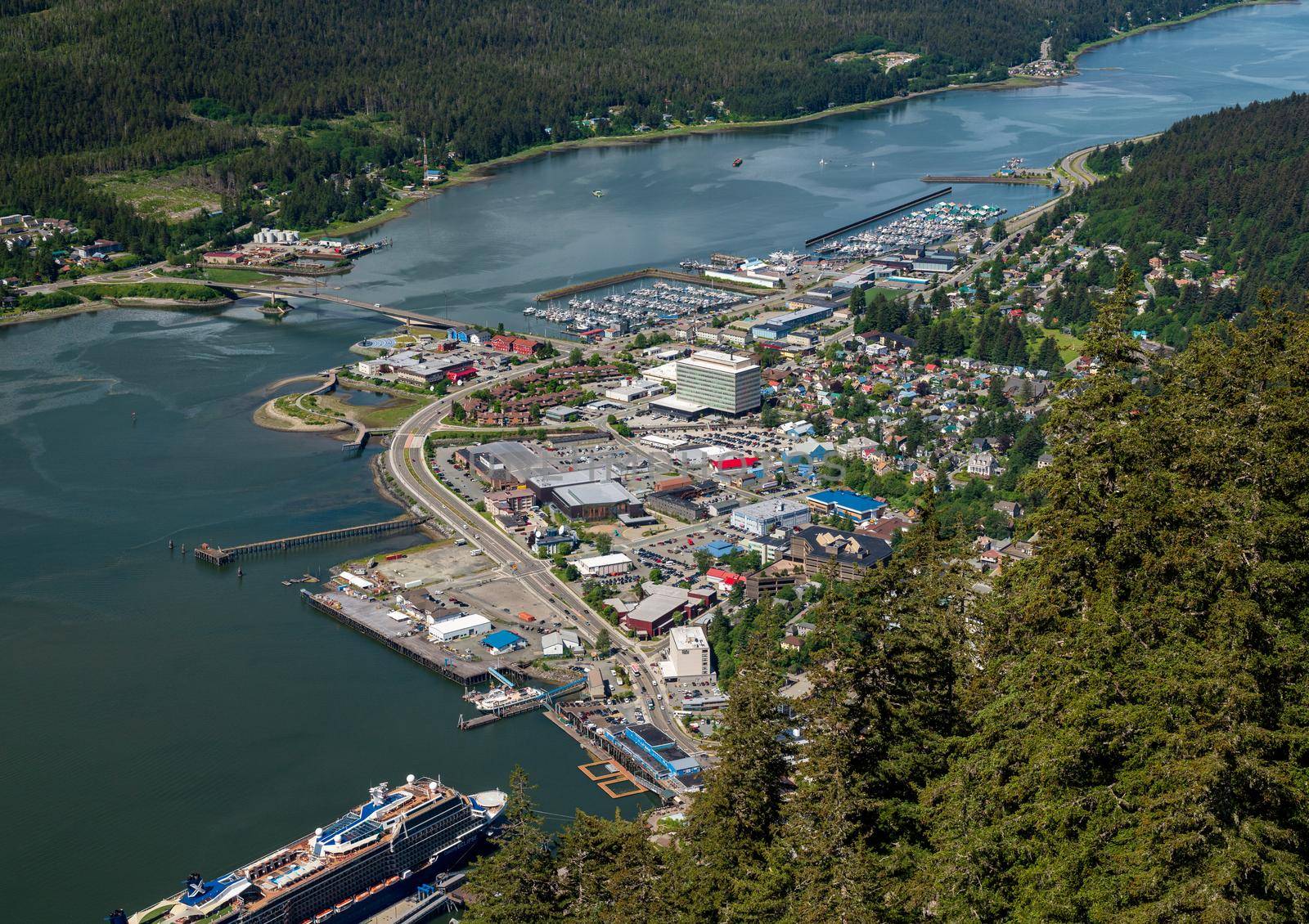 Juneau, AK - 9 June 2022: View of the port of Juneau in Alaska with cruise ships docked as seen from Mt Roberts