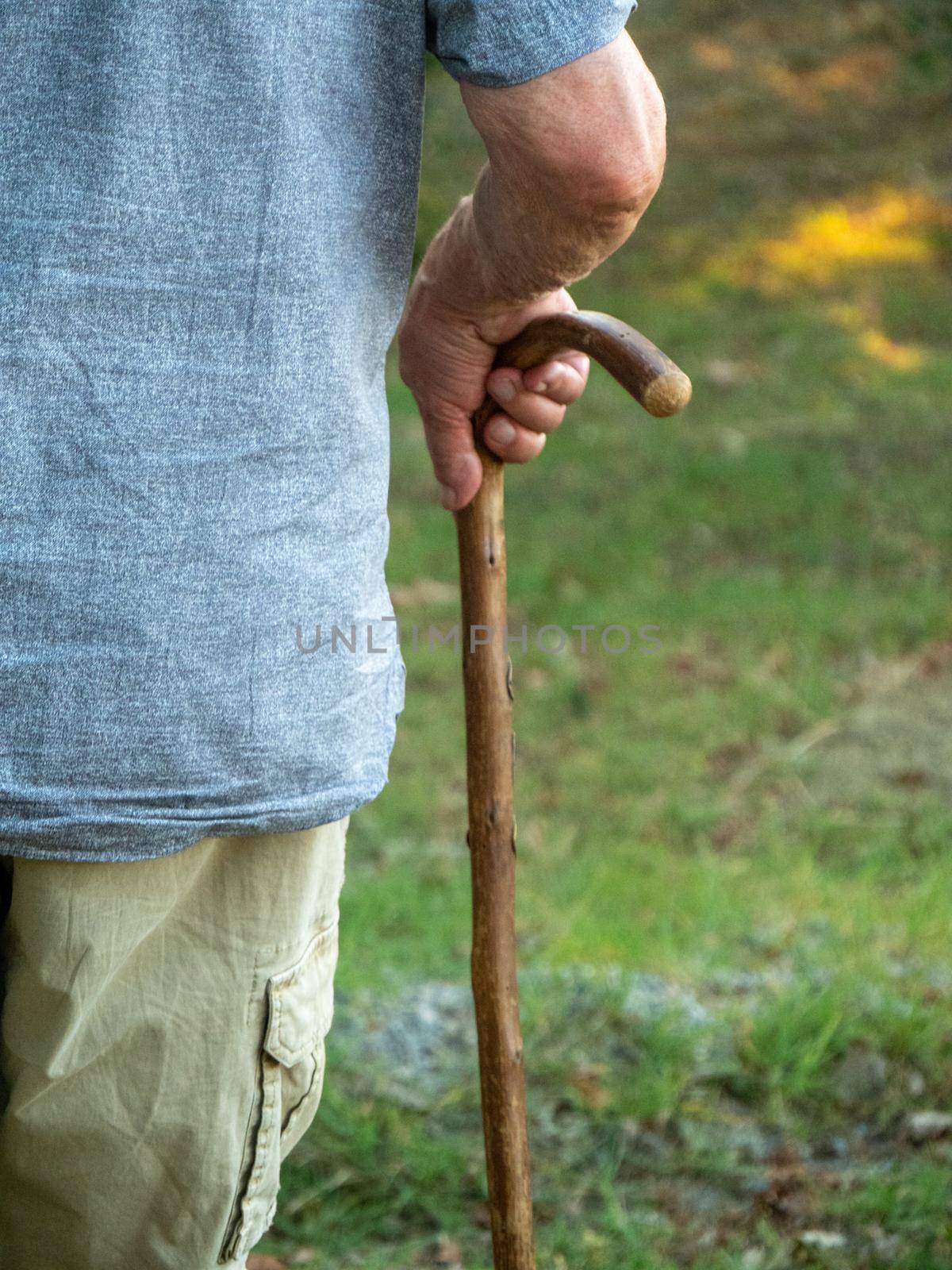 close up of wrinkled male old man on a sky pole
