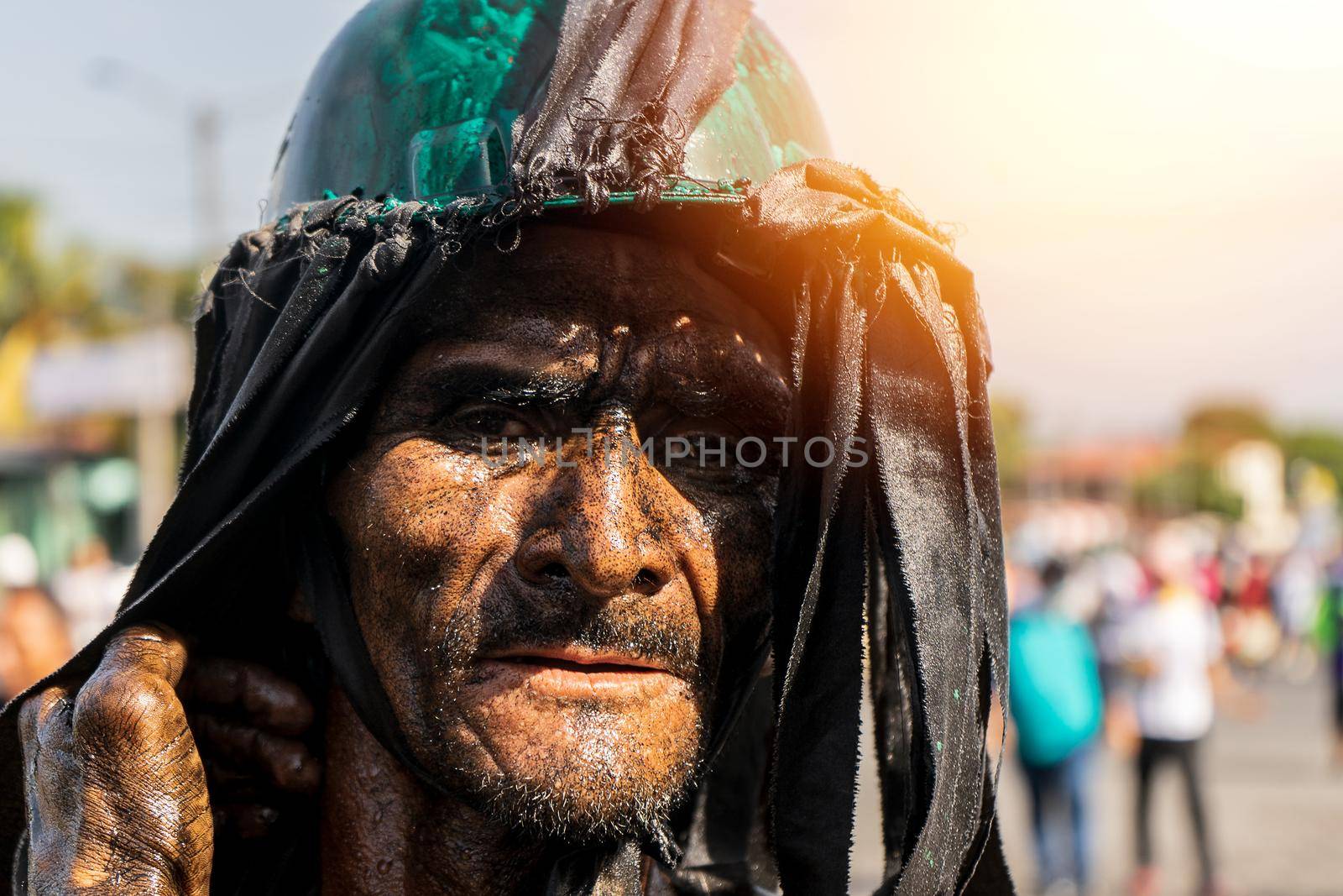 Face of a parishioner of Santo Domingo bathed in burnt oil. Culture and tradition of Nicaragua by cfalvarez