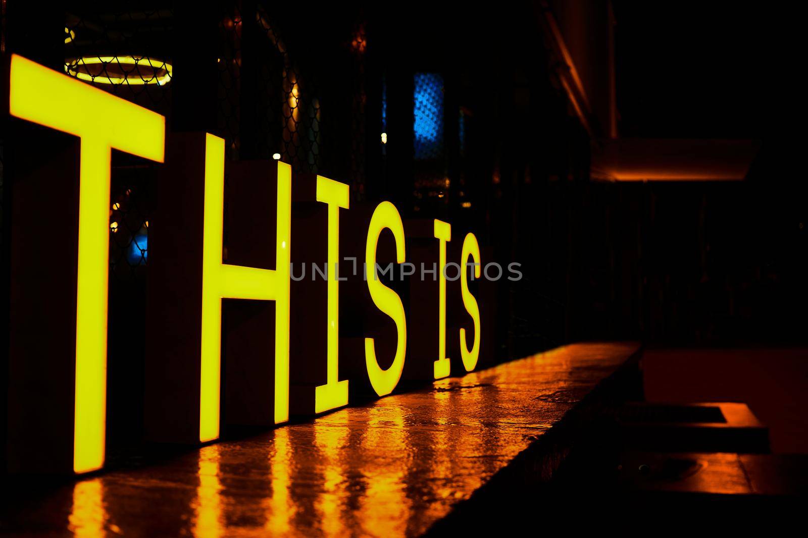 Glowing inscription this is at night in the city by jovani68