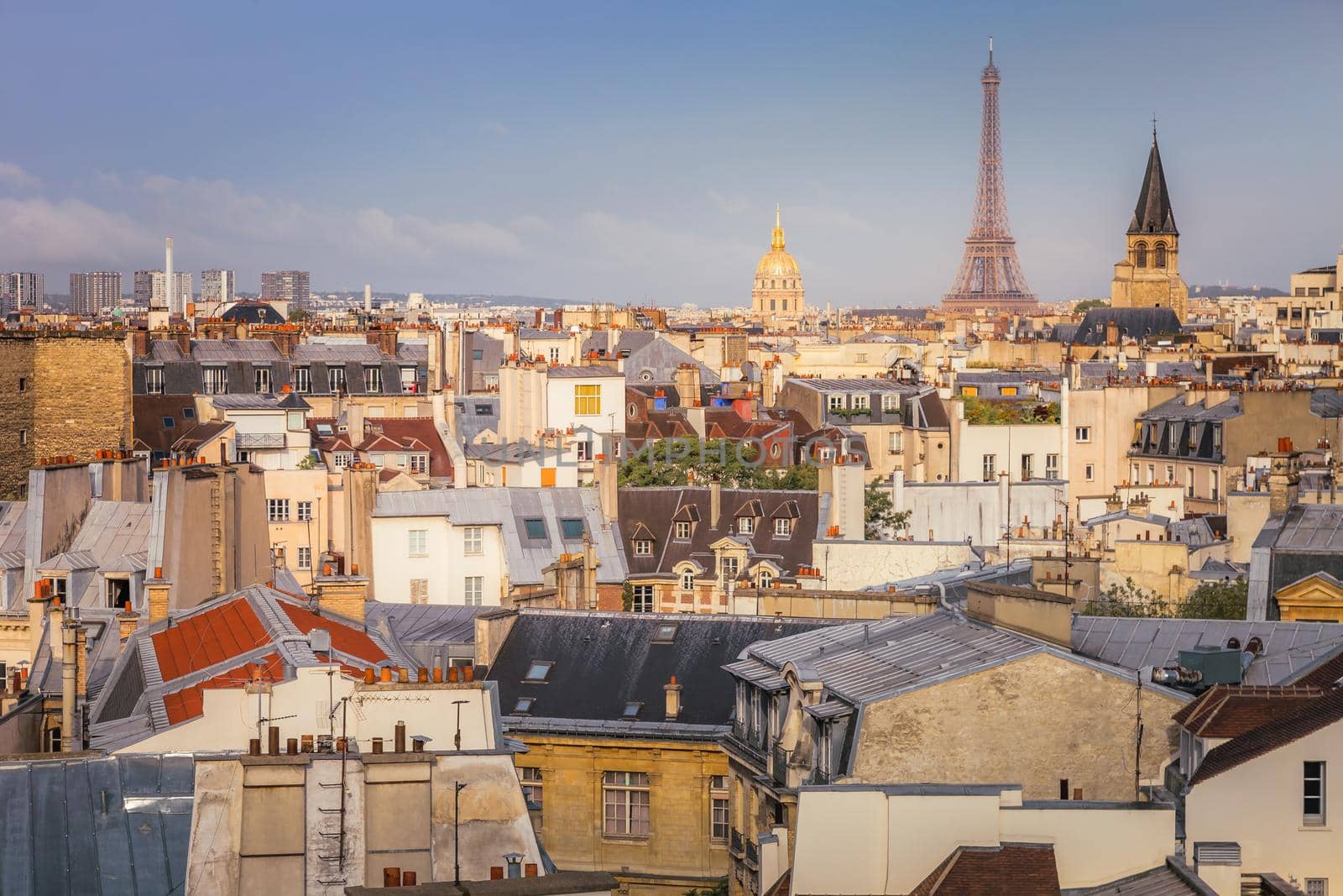 Eiffel tower and parisian roofs at sunrise Paris, France