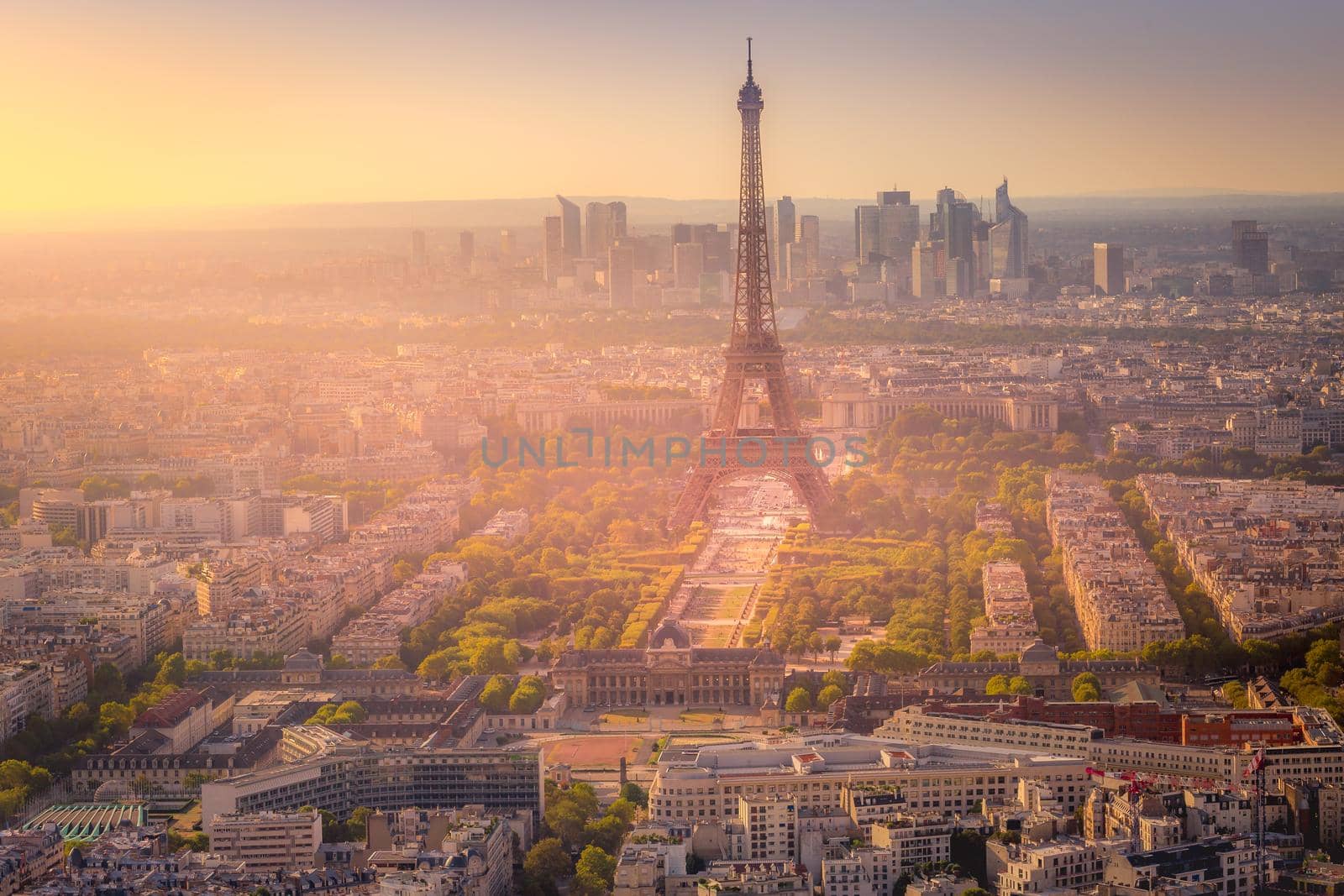 Eiffel tower and parisian roofs at dramatic sunrise Paris, France