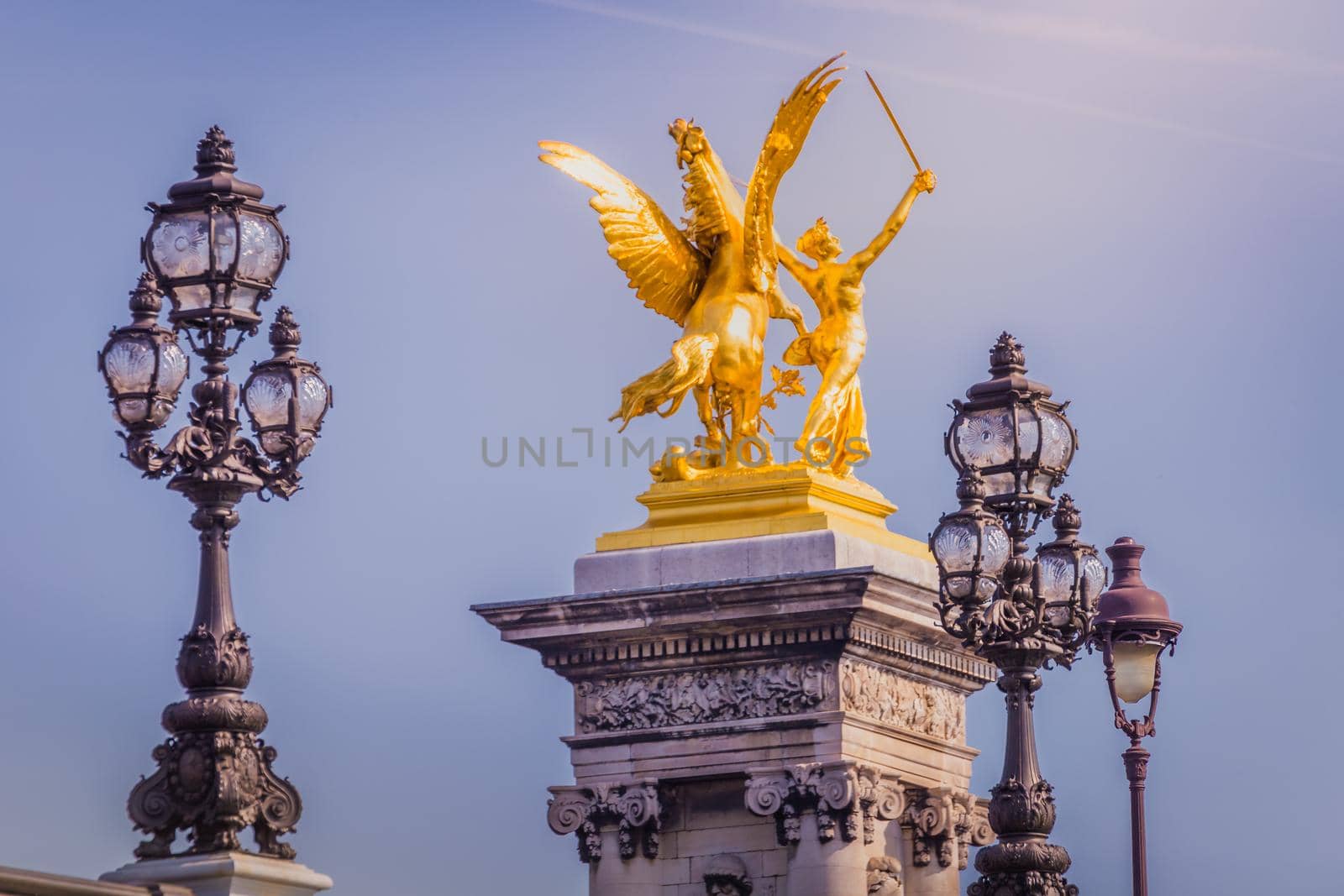 Line of Street lights and statues in Pont Alexandre III, Paris, france