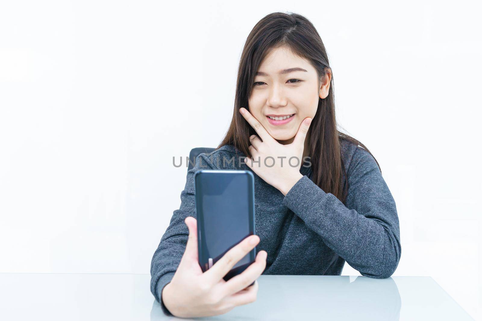 Woman long hair Woman using mobile phone and  writing notebook on white background