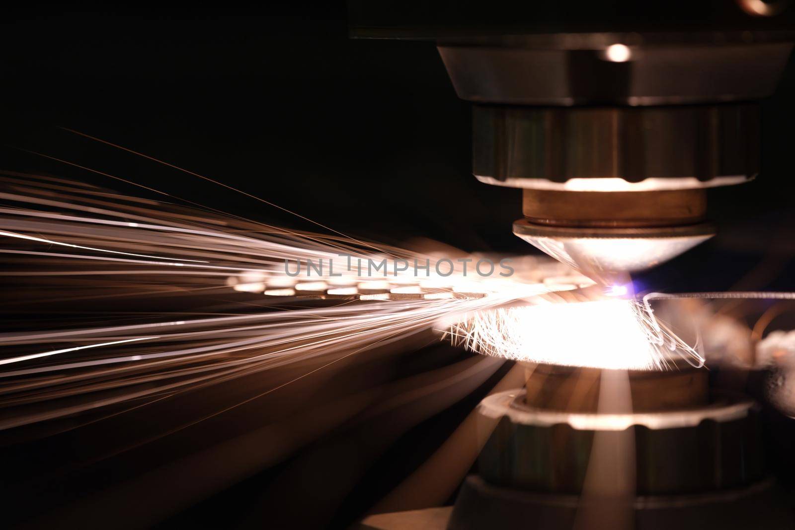 Laser cutting of metal sheet closeup. CNC Laser cutting of metal using modern industrial technologies