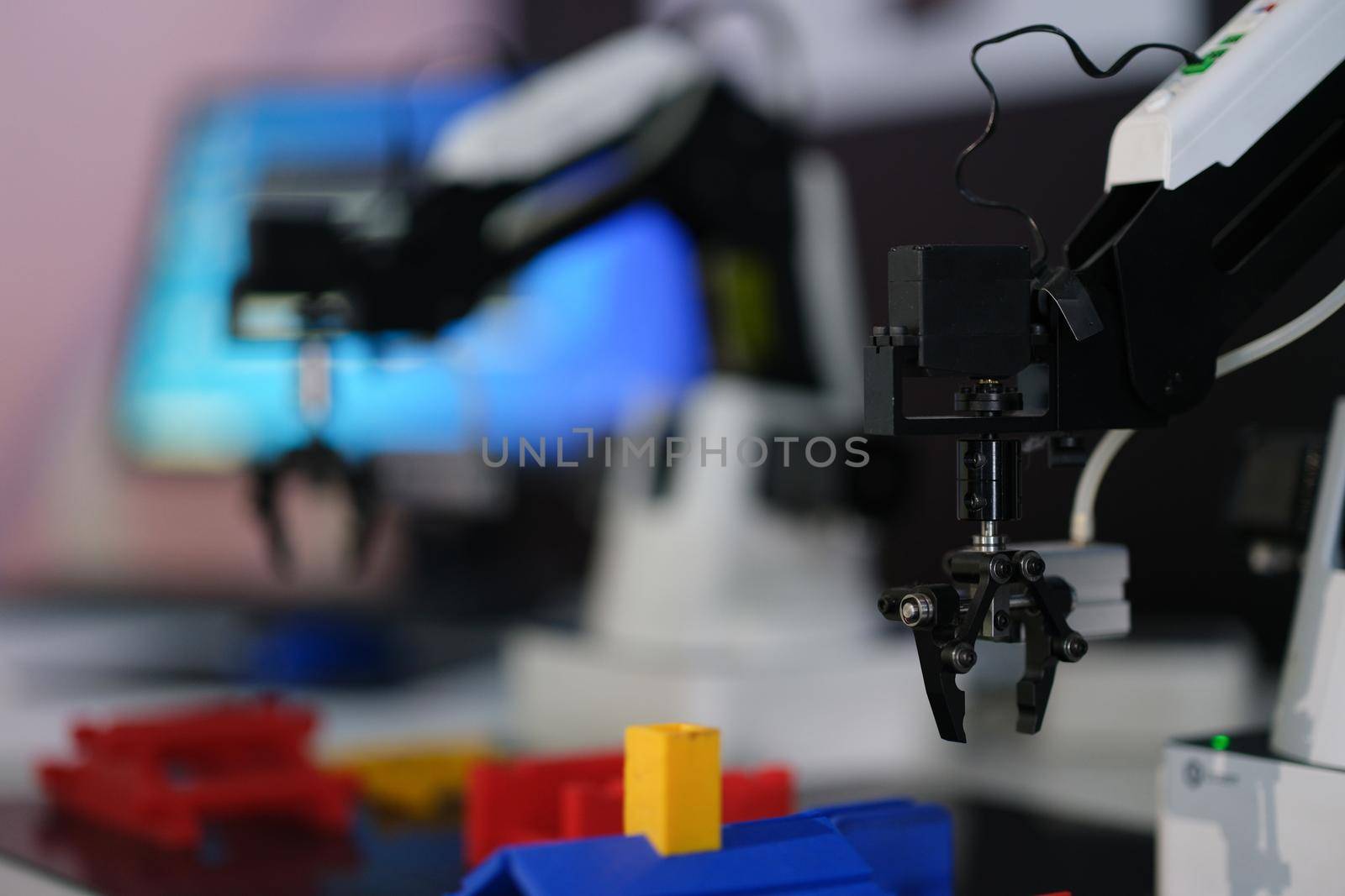 Mechanical robotic hand manipulator in industrial production. Robotic arm in factory concept