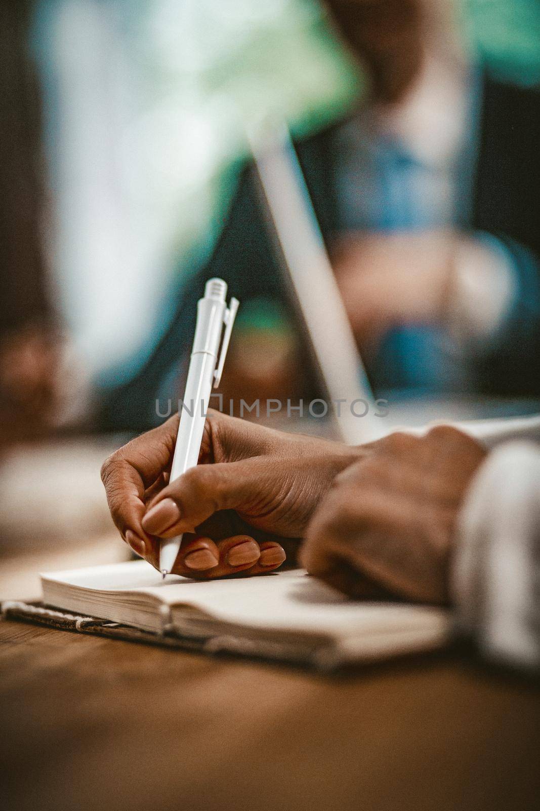 African Business Woman In Writing Or Planning In Her Notebook, Close Up Of Woman's Hand Writing In Note Pad By Pen While Sitting At Office Desk, Toned Image