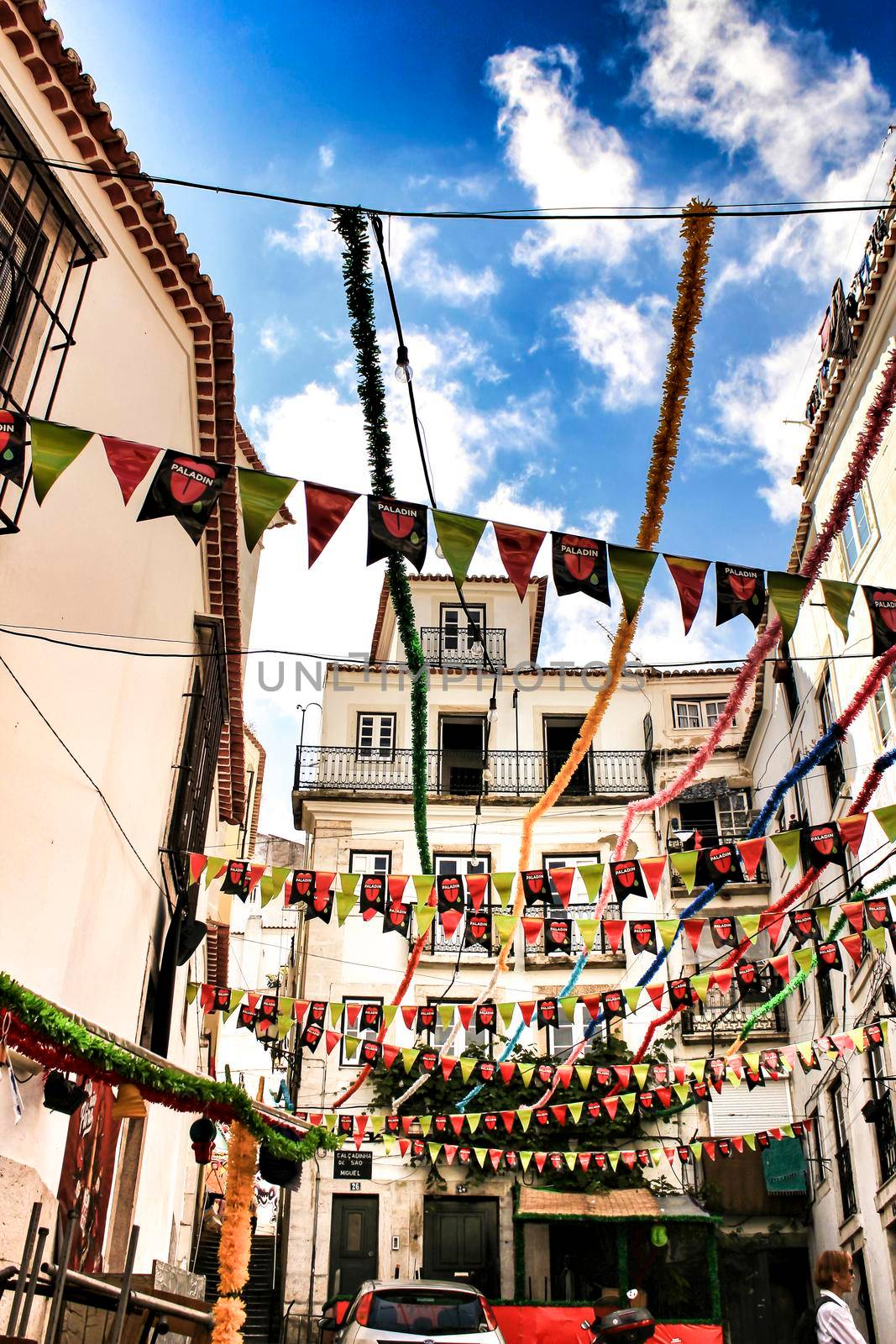 Streets adorned with garlands in Alfama, Lisbon by soniabonet