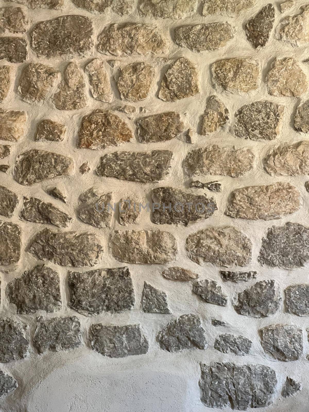Ancient masonry wall of the building. Close-up by Nadtochiy