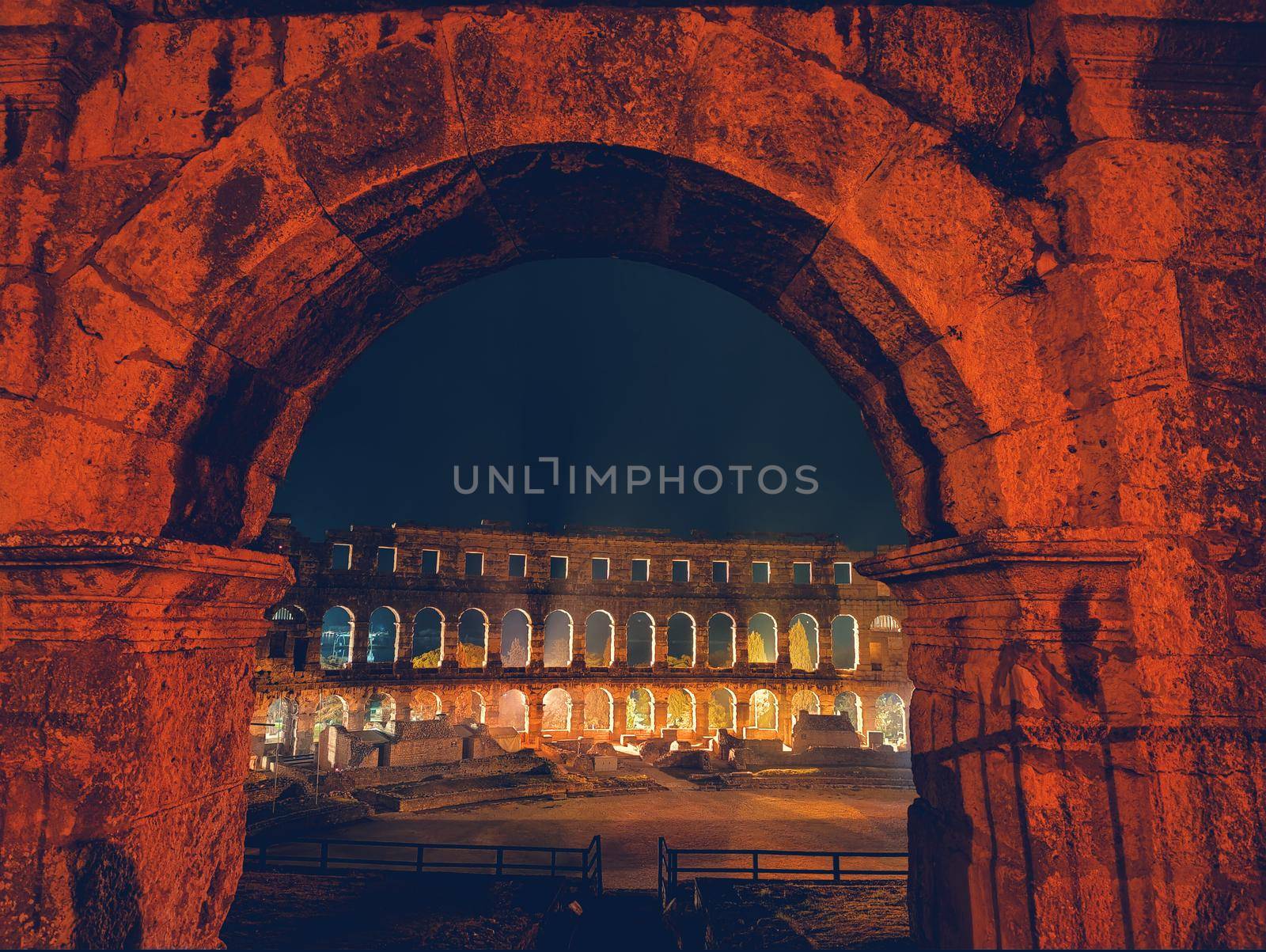 Croatia. Pula. Ruins of the best preserved Roman amphitheatre built in the first century AD during the reign of the Emperor Vespasian shot at night.