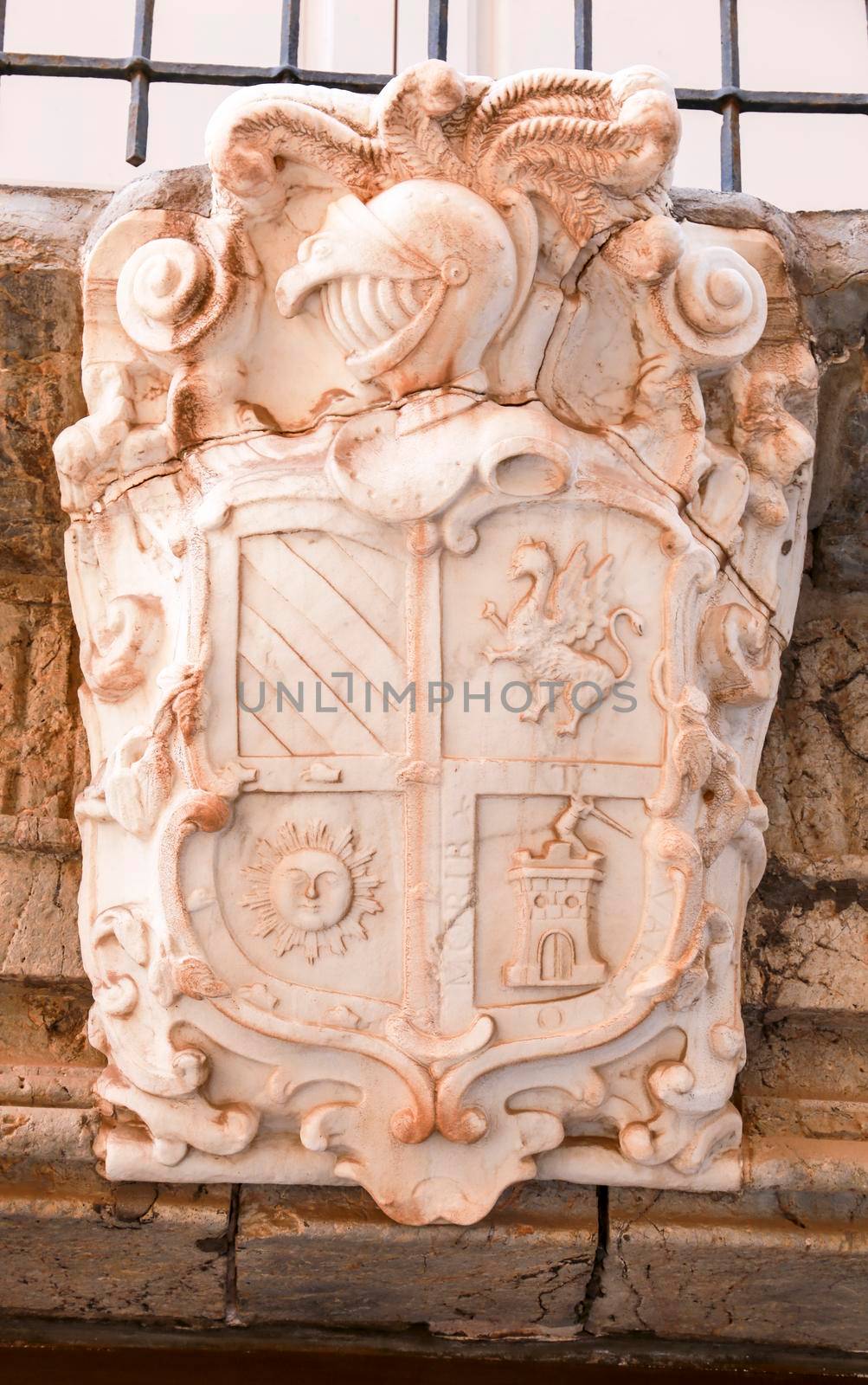 Cartagena, Murcia, Spain- July 18, 2022: Antique house on Adarve street with civilian coat of Arms made of marble