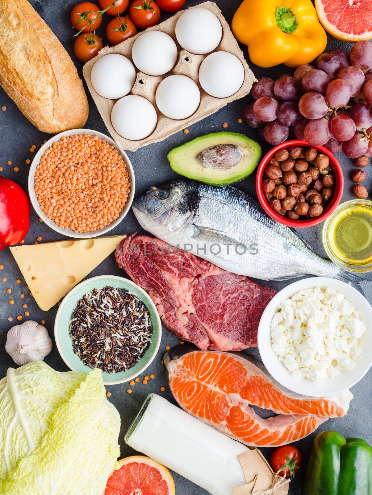 Healthy nutrition concept. Balanced healthy diet food. Meat, fish, vegetables, fruit, beans, dairy products. Top view. Cooking raw ingredients. Organic food. Clear eating. Healthy food idea. Overhead.