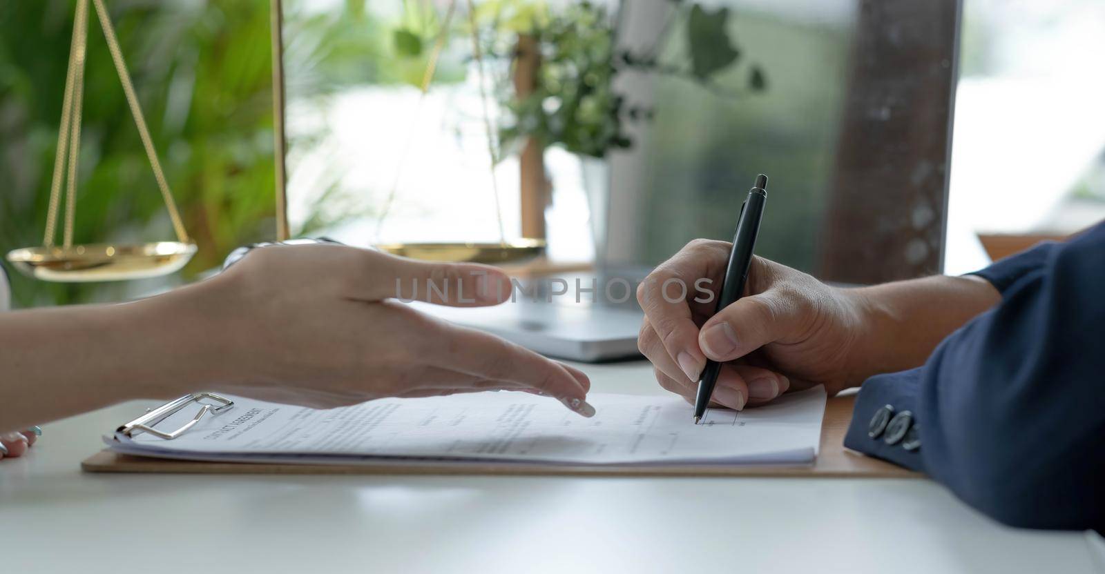 Businessman and lawyer discuss the contract document. Treaty of the law. Sign a contract business. by wichayada