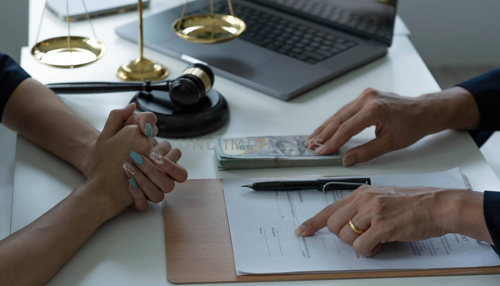 business people and lawyers discussing contract papers sitting at the table. Concepts of law, advice, legal services..