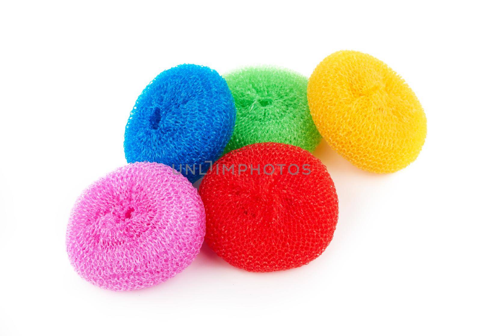 Colorful sponges for washing dishes on a white background